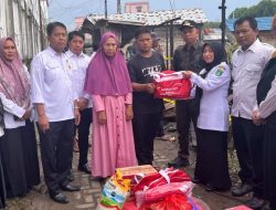 Bupati Tanbu Andi Rudi Latif, Salurkan Bantuan untuk Korban Kebakaran di Jalan Pelabuhan Samudera Simpang Empat